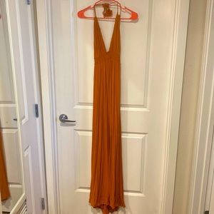 Orange maxi dress with open back and tie neck